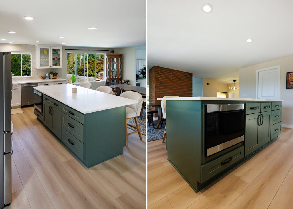 Green kitchen island with a built-in microwave drawer, quartz countertop, and black cabinet hardware, shown alongside a brick fireplace and dining area.